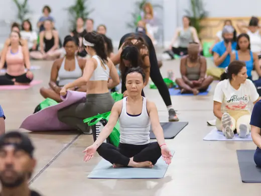Meditation attendees seated on mats