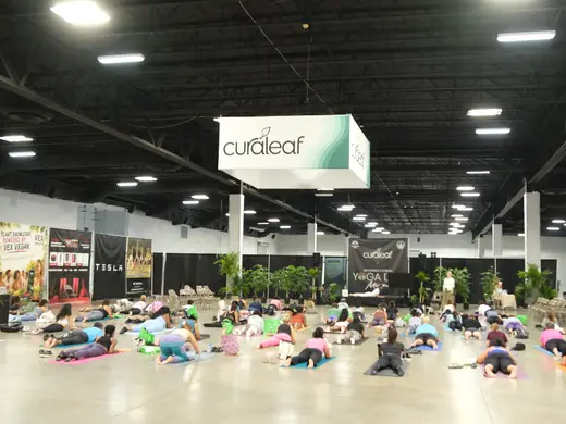 Wide yoga class inside the venue
